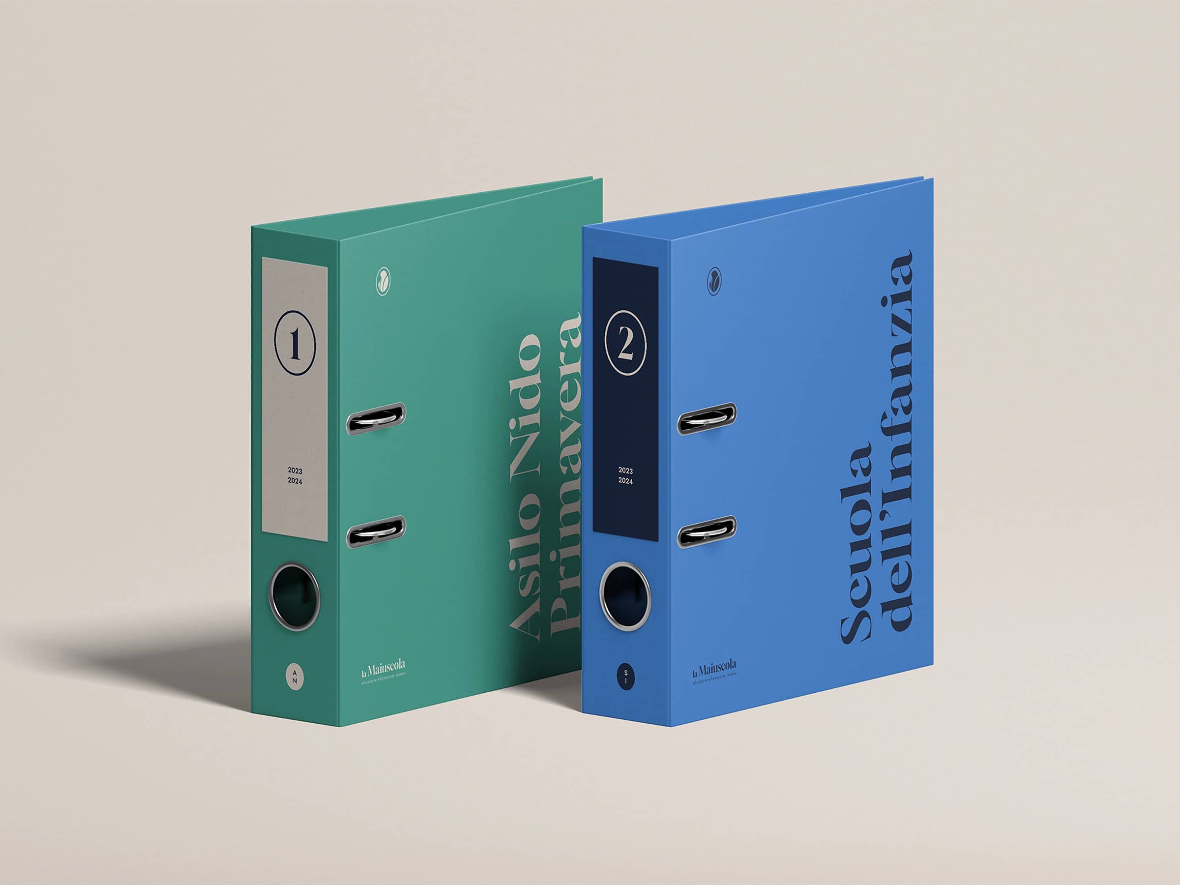 Two upright lever arch file folders, one teal labeled 'Asilo Nido Primavera' and one blue labeled 'Scuola dell'Infanzia', both marked for the years 2023-2024.