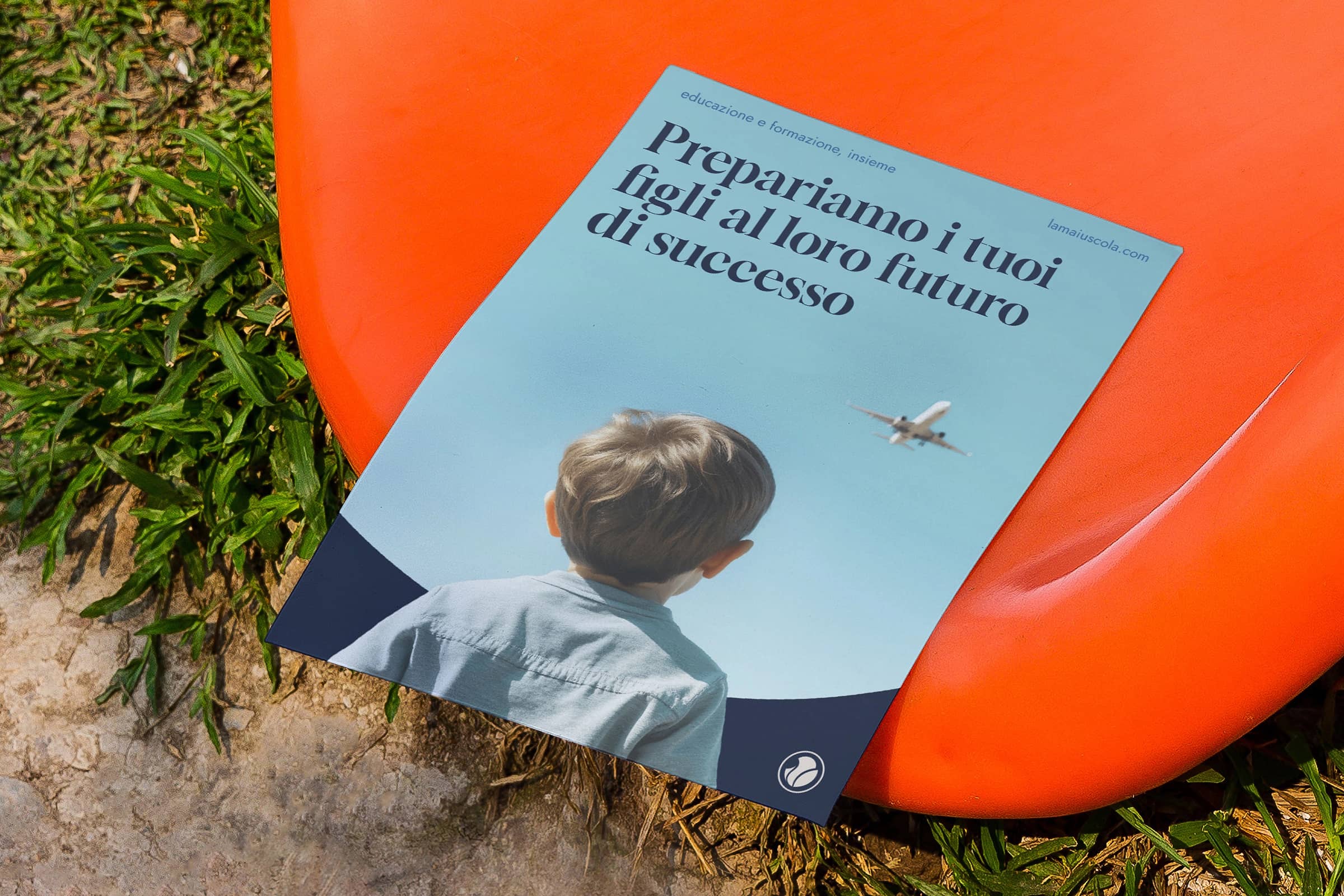 Flyer with an image of a child looking at an airplane in the sky, placed on an orange surfboard on grass.